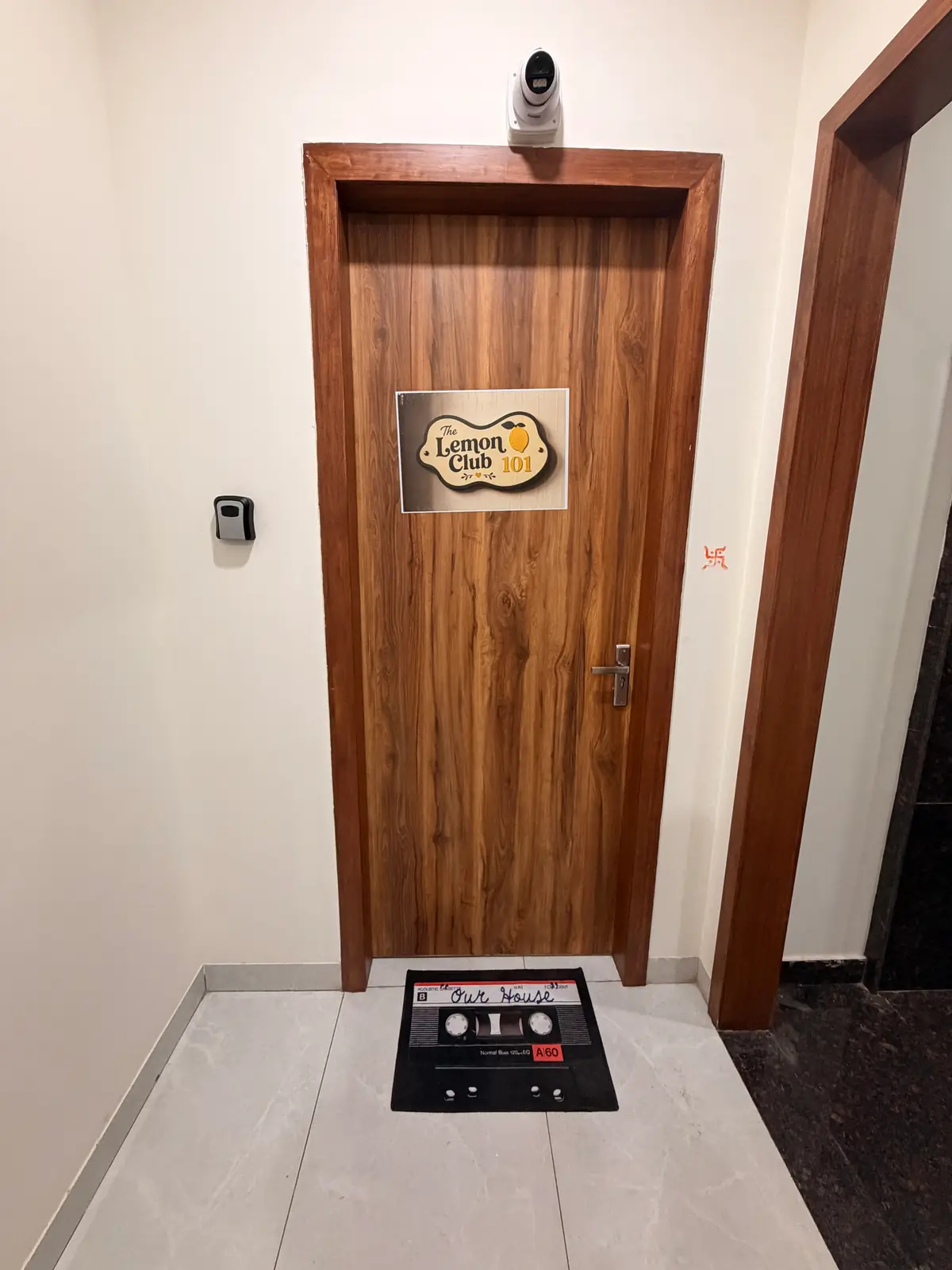 Front door of The Lemon Club 101 with cassette-tape doormat